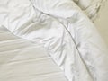 The crinkle blanket on the bed in the hotel with the sunÃ¢â¬â¹lightÃ¢â¬â¹ onÃ¢â¬â¹ theÃ¢â¬â¹ blanket